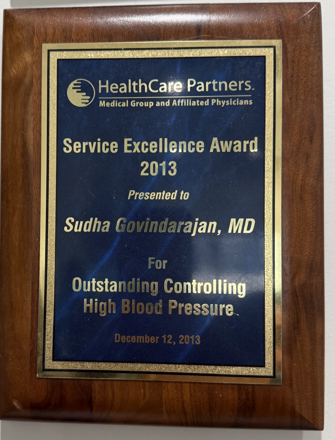 Service Excellence Award 2013 plaque presented to Sudha Govindarajan, MD for outstanding controlling high blood pressure